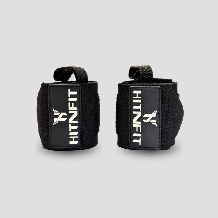 HIT N FIT black weightlifting wrist wraps with thumb loops and branded patches.