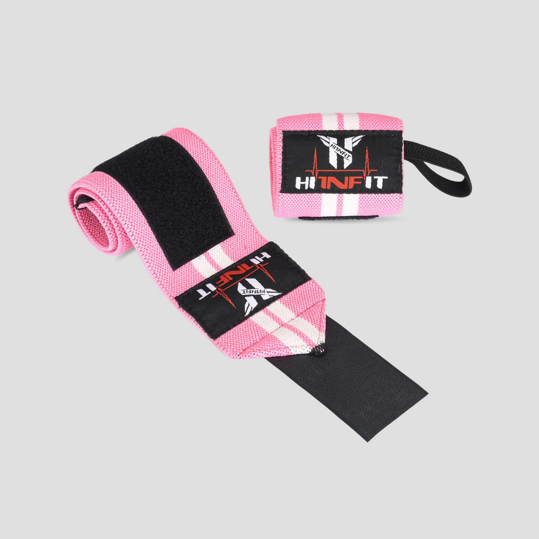 HIT N FIT pink and white weightlifting wrist wraps with black hook-and-loop fastening and thumb loops.